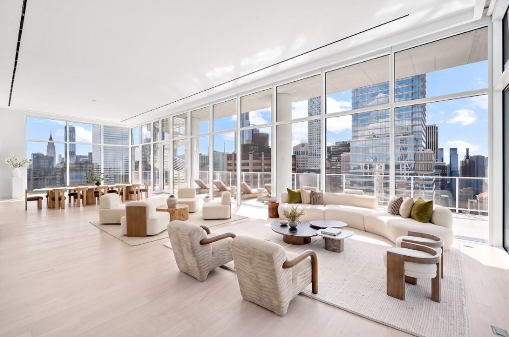 Sunlit residence living room with skyline views