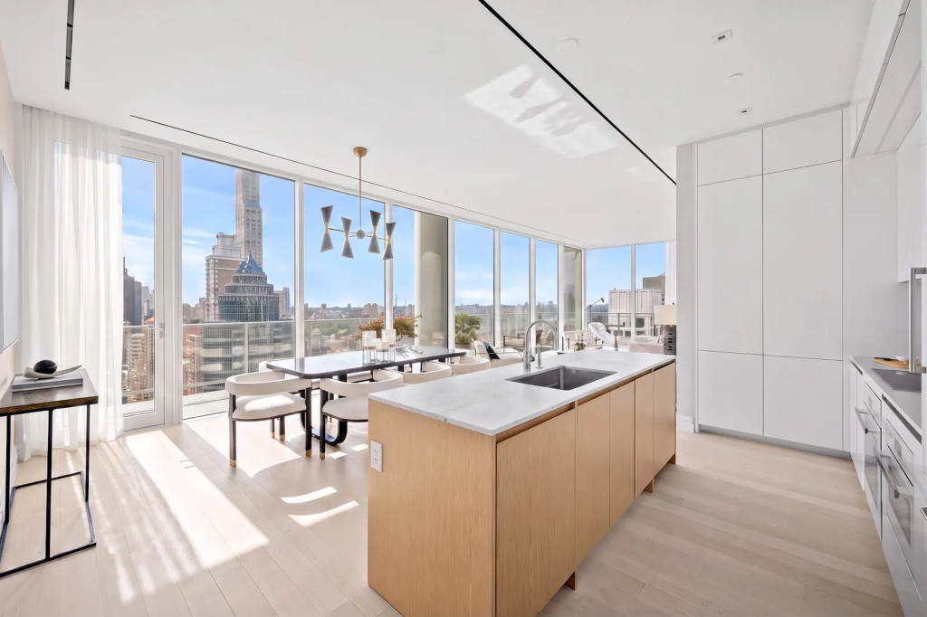 Bright kitchen and dining area in a sky residence